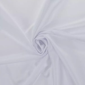 May include: White fabric with a smooth, silky texture. The fabric is draped and folded, creating soft, flowing lines.