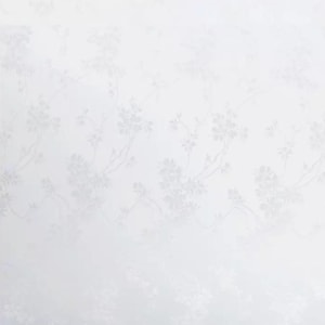 May include: White fabric with a subtle floral pattern. The design features delicate branches and blossoms, creating a soft, textured appearance. The overall aesthetic is clean and elegant, suitable for various textile applications.