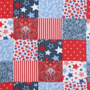 May include: A patchwork design featuring squares with patriotic patterns. The squares display red, white, and blue elements, including stars, stripes, paisley, and floral motifs. The overall theme is a celebration of Americana.