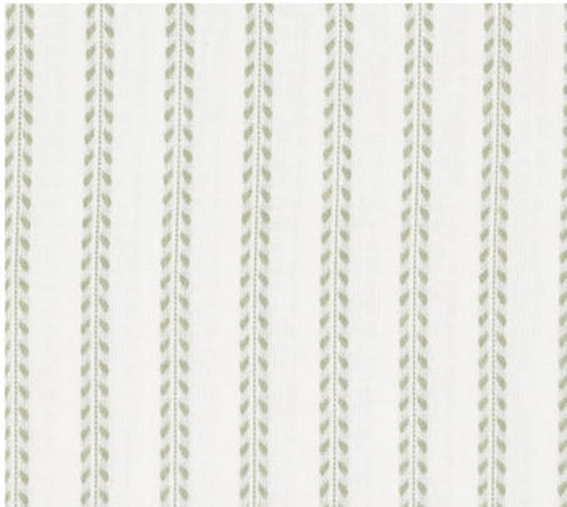 May include: White fabric with a subtle green stripe pattern. The stripes are made up of small, repeating leaf shapes.