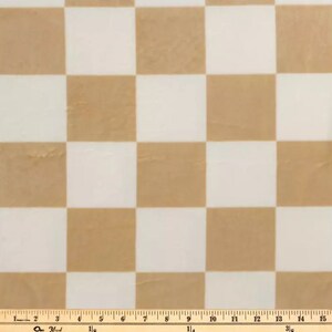 May include: A brown and white checkered fabric with a ruler measuring 15 inches.