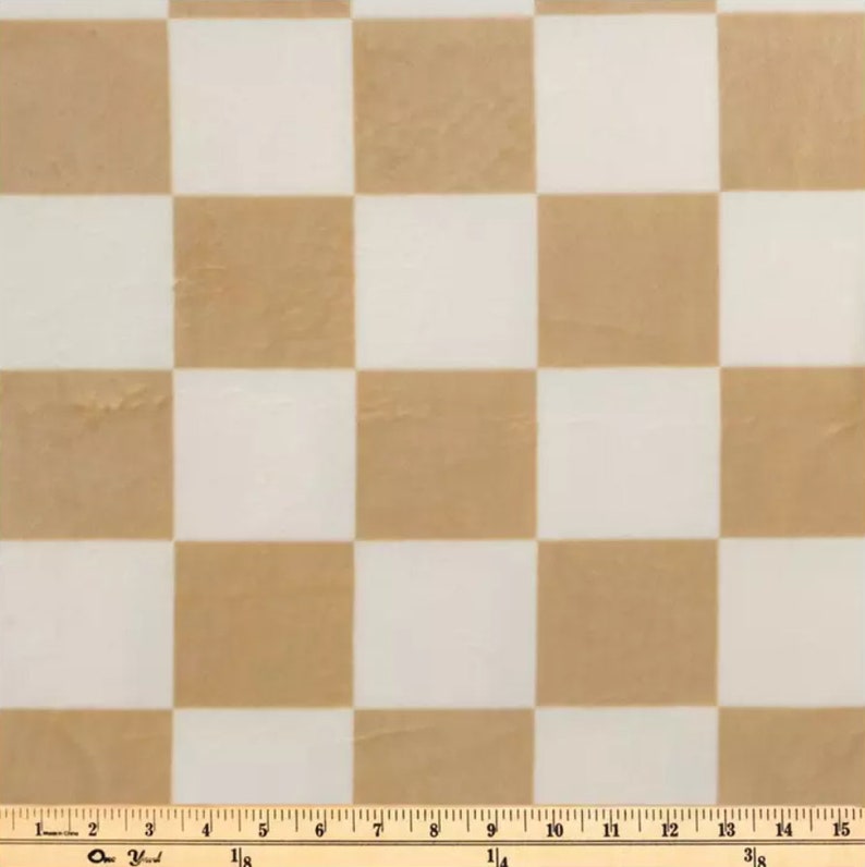 May include: A brown and white checkered fabric with a ruler measuring 15 inches.