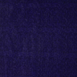May include: A close-up shot of a dark blue fabric with a repeating pattern of swirling, spiral designs. The fabric has a textured appearance, with the darker blue spirals contrasting against the slightly lighter blue background.