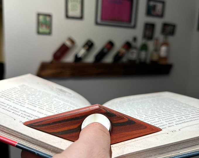 Thumb book page holder made of precious wood