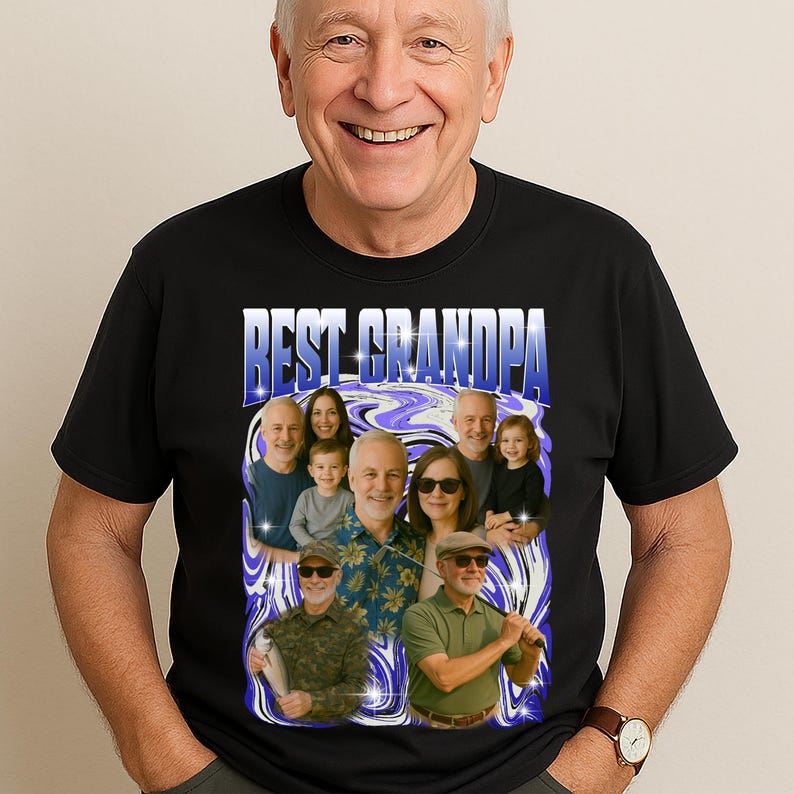 K&ouml;nnte beinhalten: Schwarzes T-Shirt mit dem Text "BEST GRANDPA" in Blau und Wei&szlig;. Das Shirt zeigt eine Grafik eines Familienportr&auml;ts mit einem blau-wei&szlig;en Wirbeldesign. Die Person, die das Shirt tr&auml;gt, l&auml;chelt.