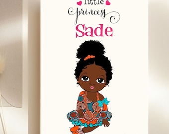 May include: A birthday card featuring a cartoon illustration of a little girl with brown skin, black hair, and a colorful dress. The text on the card reads "little princess Sade happy 1st birthday".