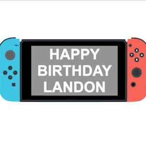May include: A blue and red Nintendo Switch console with a gray screen that says "HAPPY BIRTHDAY LANDON".