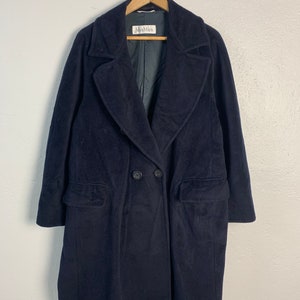 May include: A navy blue double-breasted wool coat with a large collar and two pockets. The coat has a Max Mara label.