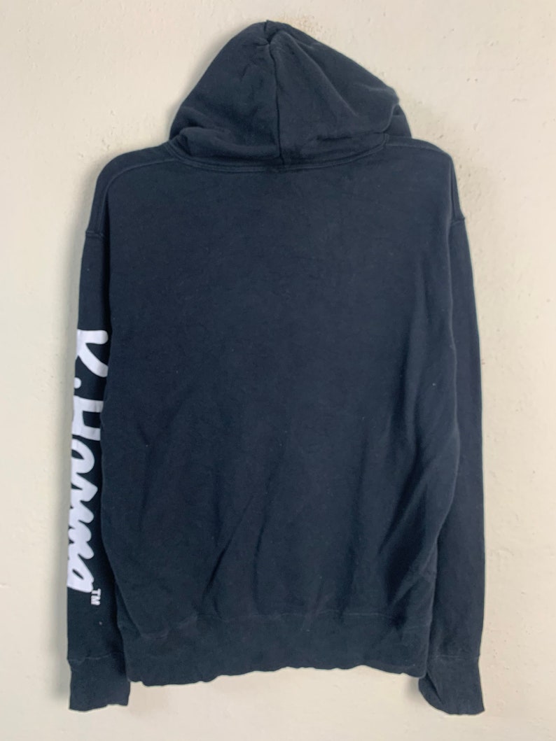 May include: Black hooded sweatshirt with white "Panama" text on the left sleeve.