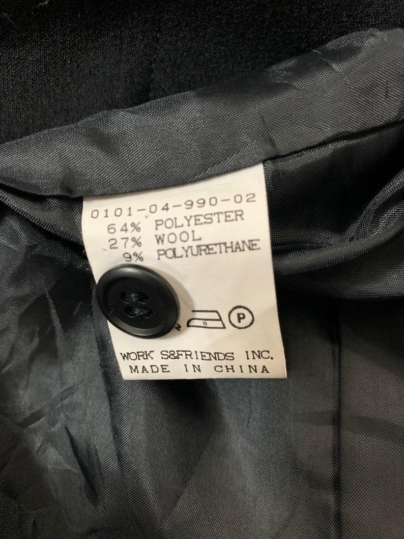May include: Black fabric label with white text that reads "0101-04-990-02 64% Polyester 27% Wool 9% Polyurethane" and "WORK S&FRIENDS INC. MADE IN CHINA".