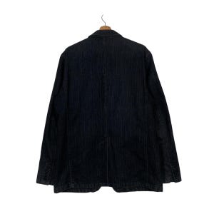 May include: A black striped blazer with a single button closure. The blazer has a classic fit and is made of a soft, comfortable fabric.