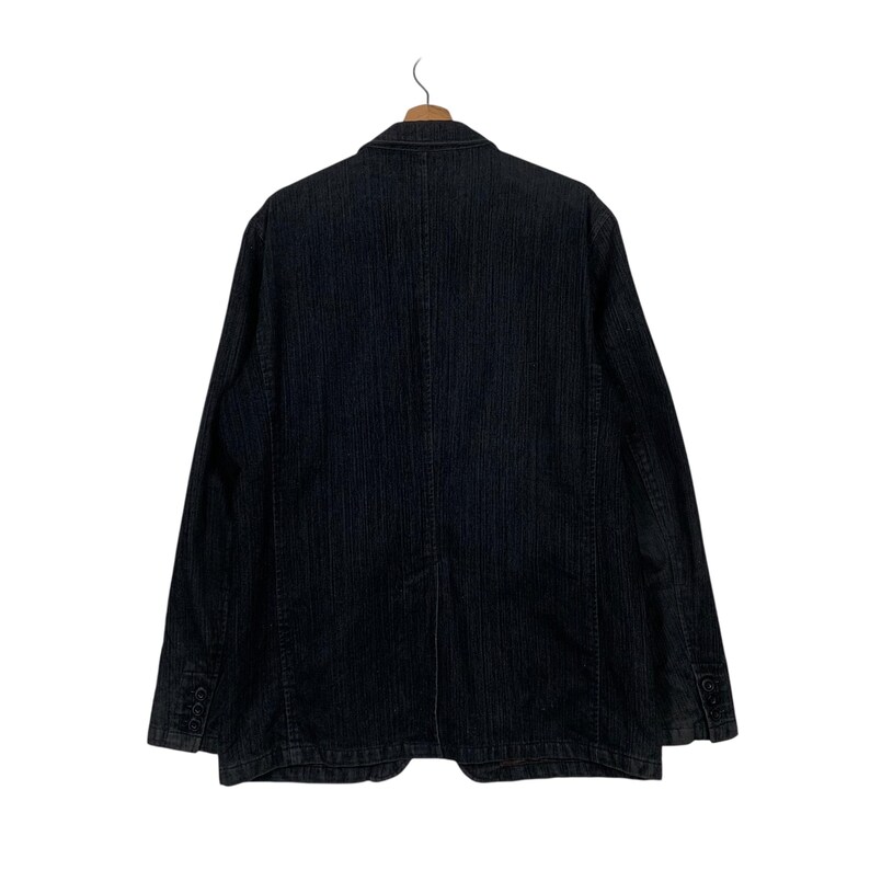 May include: A black striped blazer with a single button closure. The blazer has a classic fit and is made of a soft, comfortable fabric.