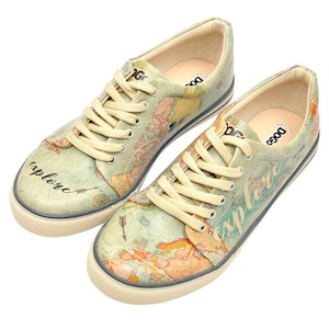 May include: A pair of light green canvas sneakers with a world map print. The left shoe says "explore" and the right shoe says "adventure".