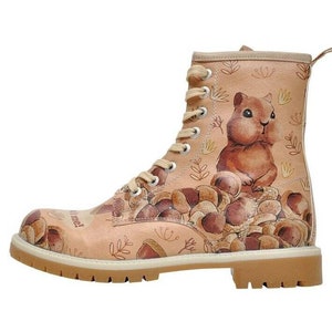 May include: Beige leather boots with a brown squirrel and mushroom print. The boots have laces and a thick sole. The text "It's fall time!" is printed on the side of the boot.