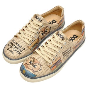 May include: A pair of beige canvas low-top sneakers with a newspaper print design. The sneakers feature an owl graphic and the text "Reading is dreaming with open eyes".
