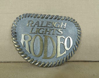 Raleigh Lights Rodeo Belt Buckle 3 3/8&quot; By 2 1/2&quot; Metal Western Style