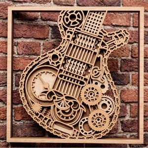 May include: A layered wooden wall art piece featuring a guitar silhouette constructed from intricate gear, sprocket, and chain motifs. The design is composed of light-toned wood cutouts arranged in a frame, showcasing mechanical details and patterns.