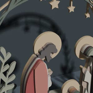 May include: A layered wooden nativity scene featuring stylized figures of Joseph and Mary with halos, positioned beneath a decorative arch adorned with leaf motifs and hanging stars. The figures are rendered in muted tones of red, beige, and gray.