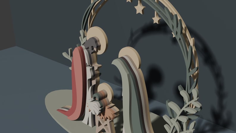May include: A layered wooden nativity scene featuring stylized figures of Mary, Joseph, and the infant Jesus. The figures are set against a circular arch decorated with leaf motifs and hanging stars, rendered in a muted palette of sage green, tan, and dusty rose.