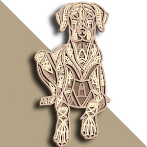 Puede incluir: Una silueta de perro de color marrón y crema con intrincados patrones geométricos. El perro está sentado con las patas cruzadas y la cabeza ligeramente inclinada hacia un lado.