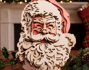 May include: A multi-layered wooden wall art piece depicting the face of Santa Claus. The design features intricate laser-cut details of a hat, bushy eyebrows, round spectacles, a mustache, and a long, flowing beard, all in natural wood tones.