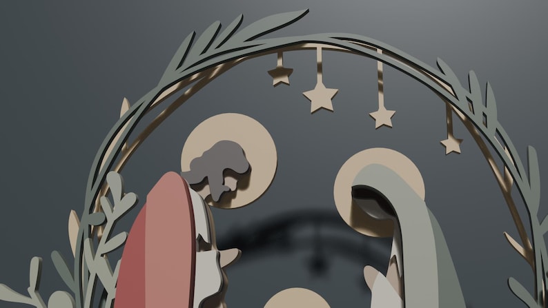 May include: A layered wooden nativity scene featuring stylized figures of two adults and a child under a circular arch decorated with leaves and hanging stars. The figures are rendered in muted tones of beige, gray, and dusty rose with circular halos.