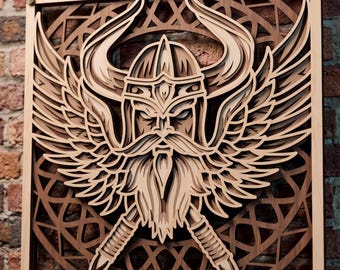 May include: A square, multi-layered wooden wall art piece featuring a central Viking figure wearing a horned helmet and a long beard. The design includes large, detailed wings and two crossed swords, all set against a circular, intricate lattice background.