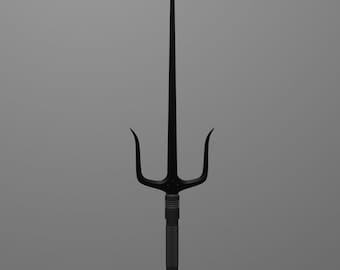 May include: A black metal three-pronged weapon with a long, thin blade. The weapon has a black handle and a red dot on each prong.