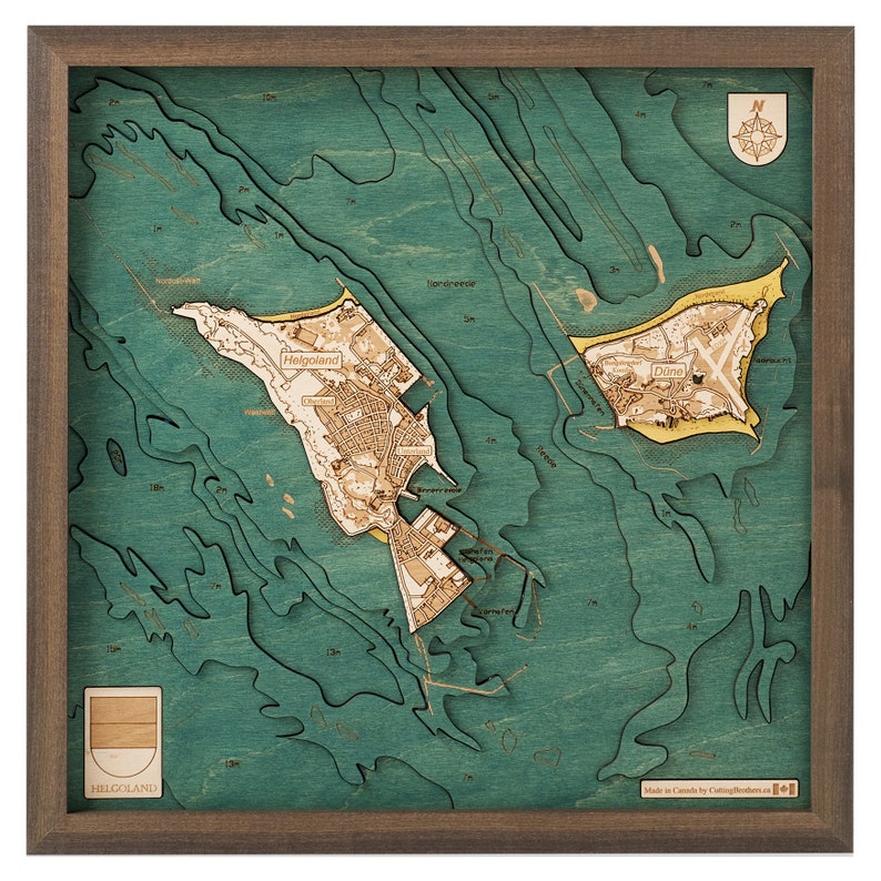 May include: A square wooden bathymetric map of Helgoland and D&uuml;ne islands, featuring layered teal water depths and tan landmasses. The map includes a compass rose, depth labels, and the text Helgoland, all enclosed in a dark brown wooden frame.