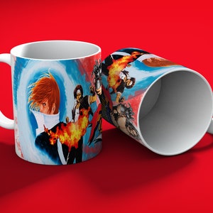 May include: White ceramic mug featuring a vibrant illustration of anime characters with fiery effects and a blue and white background. The mug is set against a red backdrop, showcasing the detailed artwork.