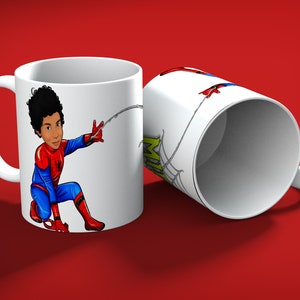 May include: Two white ceramic mugs with a Spiderman theme. One mug features a cartoon illustration of Spiderman in a dynamic pose, shooting a web. The other mug shows a partial view of the Spiderman design and web details.