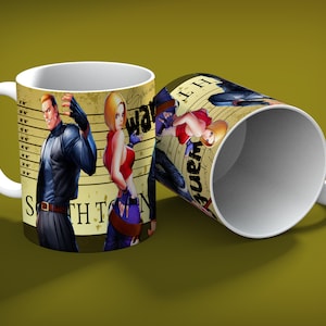 May include: White ceramic mug featuring a vintage-style design with three illustrated characters. The mug has a handle and displays the words "South Town" and "Wanted". The mug is on a green background.