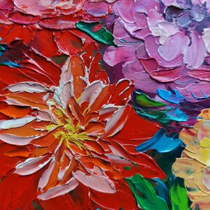 May include: Close-up of a painting of colorful flowers. The flowers are painted in a thick, impasto style, with visible brushstrokes. The colors are vibrant and include red, pink, yellow, and green.