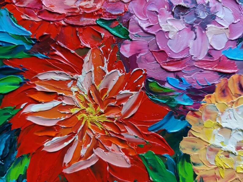 May include: Close-up of a painting of colorful flowers. The flowers are painted in a thick, impasto style, with visible brushstrokes. The colors are vibrant and include red, pink, yellow, and green.