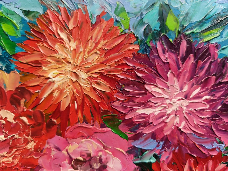 May include: Close-up of a painting featuring three vibrant flowers. The flowers are painted in shades of red, pink, and purple, with a textured brushstroke effect. The background is a mix of blue and green hues.