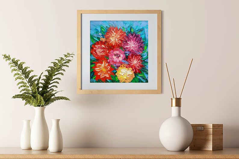May include: Framed painting of a bouquet of colorful flowers, including red, pink, orange, and yellow, against a blue background.