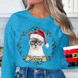 Siamese Cat Christmas Sweatshirt, Custom Name Cat Sweatshirt, Classic Holiday Cat Apparel, Unique Cat Lover Gift, Festive Cat Sweatshirt