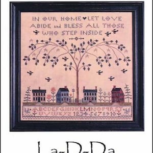May include: Cross stitch pattern featuring a tree with birds and houses. The text reads "In our home let love abide and bless all those who step inside". The pattern is from La-D-Da designs for counted thread.