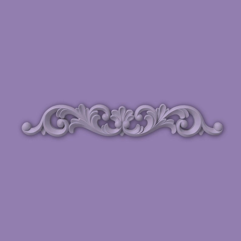 May include: A light grey, symmetrical scrollwork design with a floral motif. The design features swirling patterns, leaves, and rounded elements, set against a lavender background. This ornate element is suitable for various decorative applications.