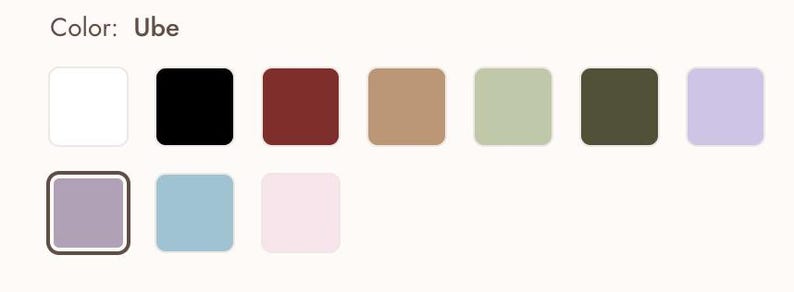 May include: A color palette featuring a variety of square swatches. The swatches include white, black, burgundy, tan, light green, olive green, and lavender. Additional colors are a lavender square with a dark border, light blue, and pink.