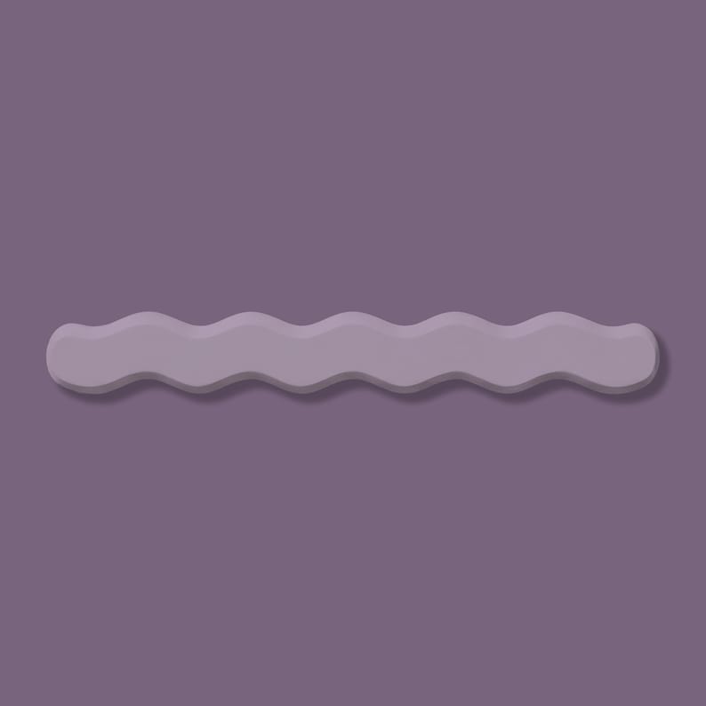 May include: A wavy, light purple hair clip against a darker purple background. The clip has a smooth, matte finish and a subtle shadow, creating a three-dimensional effect. The design is simple and modern, suitable for various hairstyles.