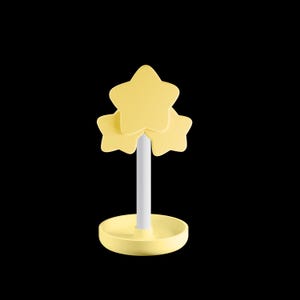 May include: A yellow star-shaped decorative object with a white stem and a round base. The object features three stacked stars at the top. The base is a matching yellow colour. The background is black.