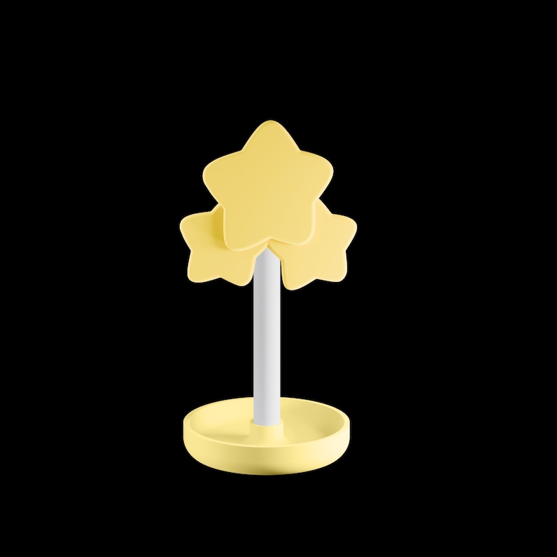 May include: A yellow star-shaped decorative object with a white stem and a round base. The object features three stacked stars at the top. The base is a matching yellow colour. The background is black.