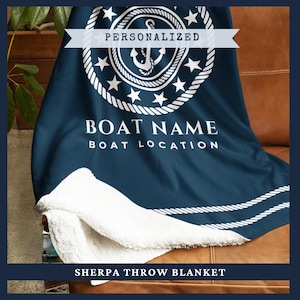 May include: Navy blue sherpa throw blanket with a white nautical design featuring an anchor, stars, and rope detailing. The blanket is personalized with the text "BOAT NAME" and "BOAT LOCATION". The words "PERSONALIZED" and "SHERPA THROW BLANKET" are also visible.