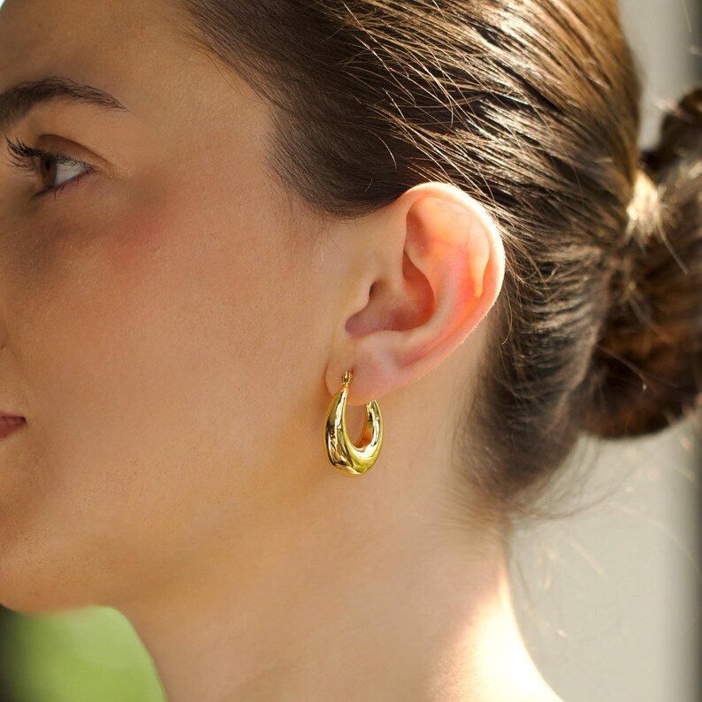 gold hoop earrings, oval chunky hoops