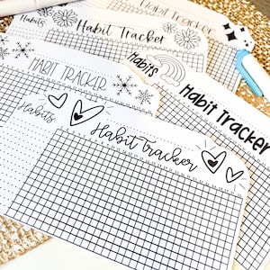 May include: Five black and white habit tracker printable sheets with different designs. Each sheet has a grid with numbers 1-31 and the words "Habit Tracker" and "Habits".