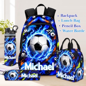 May include: A backpack, lunch bag, pencil box, and water bottle set featuring a blue flame and soccer ball graphic. Each item displays the name Michael in white text. The set includes a black backpack, a black lunch bag, a black pencil box, and a black water bottle with a handle.