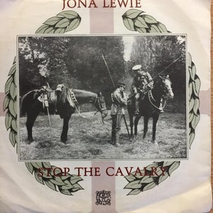 May include: A black and white photo of two soldiers on horseback in a forest. The photo is from the early 1900s and is a vintage record cover for the song "Stop the Cavalry" by Jona Lewie.