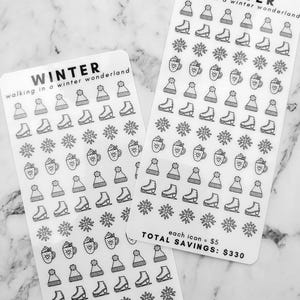 May include: Two sheets of winter themed stickers with a variety of designs including snowflakes, ice skates, winter hats, and mugs of hot chocolate. The text on the sheets reads "Winter walking in a winter wonderland" and "each icon = $5 Total Savings: $330".