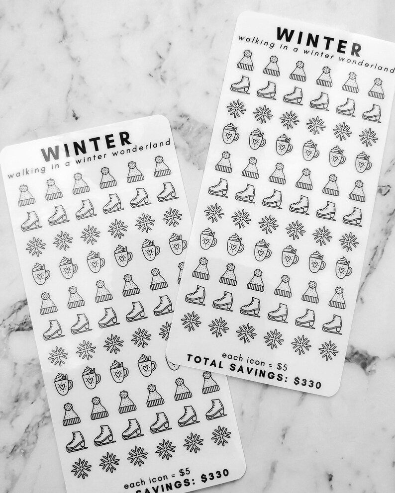 May include: Two sheets of winter themed stickers with a variety of designs including snowflakes, ice skates, winter hats, and mugs of hot chocolate. The text on the sheets reads "Winter walking in a winter wonderland" and "each icon = $5 Total Savings: $330".